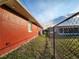 Side yard with propane tank and chain link fence at 23104 Rountree Ave, Port Charlotte, FL 33980