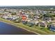 Property located on the lake with neighboring houses at 2321 Sofia Ln, Punta Gorda, FL 33983