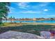Landscaped backyard with lake view at 2321 Sofia Ln, Punta Gorda, FL 33983