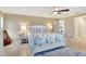 Bright bedroom featuring a queen-size bed and a view of another room at 2321 Sofia Ln, Punta Gorda, FL 33983