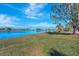 Tranquil lakefront view with mature trees at 2321 Sofia Ln, Punta Gorda, FL 33983