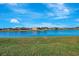 Scenic view of lakefront homes and lush landscape at 2321 Sofia Ln, Punta Gorda, FL 33983
