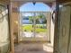 View of the front yard from the decorated doorway, offering curb appeal and enhanced security at 23308 Painter Ave, Port Charlotte, FL 33954