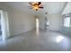 Bright living room featuring tile floors and a ceiling fan at 23308 Painter Ave, Port Charlotte, FL 33954