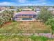 Aerial view showcasing home's pool and backyard oasis at 24 Oakland Hills Ct, Rotonda West, FL 33947