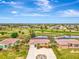 Aerial view highlighting home's location in the community at 24 Oakland Hills Ct, Rotonda West, FL 33947