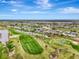 Aerial view of community, showcasing green spaces and waterways at 24 Oakland Hills Ct, Rotonda West, FL 33947