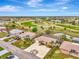 Aerial view showing homes near golf course at 24 Oakland Hills Ct, Rotonda West, FL 33947