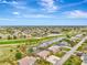 Aerial view of houses and golf course at 24 Oakland Hills Ct, Rotonda West, FL 33947