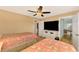 Bedroom with two twin beds and large TV at 24 Oakland Hills Ct, Rotonda West, FL 33947