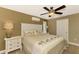 Spacious bedroom with a king-size bed and a ceiling fan at 24 Oakland Hills Ct, Rotonda West, FL 33947