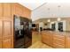 Spacious kitchen with stainless steel appliances and an island at 24 Oakland Hills Ct, Rotonda West, FL 33947