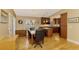 Bright kitchen and dining area with hardwood floors and an island at 24 Oakland Hills Ct, Rotonda West, FL 33947