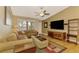Bright and airy living room with hardwood floors and comfy sofas at 24 Oakland Hills Ct, Rotonda West, FL 33947