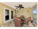 Relaxing screened patio with table and chairs, perfect for outdoor dining at 24 Oakland Hills Ct, Rotonda West, FL 33947