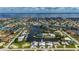 Stunning aerial view of waterfront property featuring canals, and beautiful neighborhood layout at 2750 W Marion Ave, Punta Gorda, FL 33950