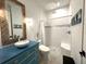 Bright bathroom featuring a stand-up shower with a decorative vanity and nautical decor at 2750 W Marion Ave, Punta Gorda, FL 33950