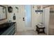 Bathroom featuring coastal decor, a modern vanity, and walk out to patio access at 2750 W Marion Ave, Punta Gorda, FL 33950