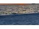 Beach view featuring the sand, water, and a beautiful sunset over the horizon at 2750 W Marion Ave, Punta Gorda, FL 33950
