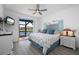 Cozy bedroom with ceiling fan and water views, featuring a coastal-themed decor and light-filled ambiance at 2750 W Marion Ave, Punta Gorda, FL 33950
