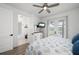 Tranquil bedroom with an ensuite bathroom, private outdoor access, and stylish coastal decor at 2750 W Marion Ave, Punta Gorda, FL 33950