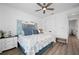 Comfortable bedroom with water views, featuring coastal accents, a ceiling fan, and ample closet space at 2750 W Marion Ave, Punta Gorda, FL 33950