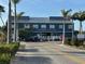 Exterior view of Fisherman's Village commercial building with palm trees and street access at 2750 W Marion Ave, Punta Gorda, FL 33950
