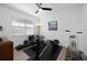 Bright exercise room featuring a ceiling fan, weights, and fitness equipment at 2750 W Marion Ave, Punta Gorda, FL 33950