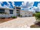 Charming home featuring a paver driveway, three-car garage, and well-manicured landscaping at 2750 W Marion Ave, Punta Gorda, FL 33950