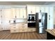 Well-equipped kitchen with white cabinetry, stainless steel appliances, modern oven, and granite countertops at 2750 W Marion Ave, Punta Gorda, FL 33950