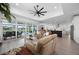 Spacious living room showcasing an open layout with pool views and seamless access to the kitchen at 2750 W Marion Ave, Punta Gorda, FL 33950