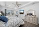 Inviting main bedroom features a serene color palette, stylish decor, lots of natural light, and an ensuite bathroom at 2750 W Marion Ave, Punta Gorda, FL 33950