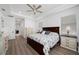 Bright main bedroom with hard surface floors, recessed lighting, and bedside tables and lamps at 2750 W Marion Ave, Punta Gorda, FL 33950
