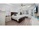Spacious main bedroom features a tray ceiling, neutral decor, ample natural light, and an ensuite bathroom at 2750 W Marion Ave, Punta Gorda, FL 33950