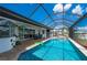 Screened in pool and patio featuring ample seating and an outdoor kitchen at 2750 W Marion Ave, Punta Gorda, FL 33950