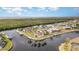 Waterfront property showcasing a grand home with lush landscaping and private dockage at 3324 Antigua Dr, Punta Gorda, FL 33950
