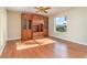 Bedroom with hardwood floors, built-in cabinetry, and a large window at 3324 Antigua Dr, Punta Gorda, FL 33950