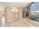 Bright dining area with a chandelier and views of the pool at 3324 Antigua Dr, Punta Gorda, FL 33950
