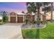 Beautiful one-story home with a two-car garage, palm trees, and landscaped yard at 3324 Antigua Dr, Punta Gorda, FL 33950