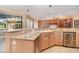 Kitchen island with granite countertop and stainless steel appliances at 3324 Antigua Dr, Punta Gorda, FL 33950
