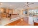 Open kitchen and dining area with hardwood floors and pool view at 3324 Antigua Dr, Punta Gorda, FL 33950