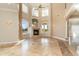 Spacious living room featuring a grand fireplace and large windows at 3324 Antigua Dr, Punta Gorda, FL 33950