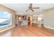 Bright loft with hardwood floors, arched windows, and a ceiling fan at 3324 Antigua Dr, Punta Gorda, FL 33950
