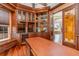 Spacious office with custom wooden built-ins and wine cooler at 3324 Antigua Dr, Punta Gorda, FL 33950