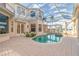 Inviting kidney-shaped pool with a screened enclosure and brick pavers at 3324 Antigua Dr, Punta Gorda, FL 33950
