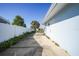 Side yard with concrete patio and fence at 3355 Elkcam Blvd, Port Charlotte, FL 33952