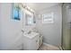 Clean bathroom with white vanity and shower at 3355 Elkcam Blvd, Port Charlotte, FL 33952