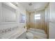 Clean bathroom with a bathtub, shower, and marble-top vanity at 3355 Elkcam Blvd, Port Charlotte, FL 33952