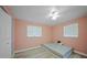 Small bedroom with light pink walls and hardwood floors at 3355 Elkcam Blvd, Port Charlotte, FL 33952