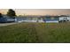 Single story home with a well-maintained lawn at 3355 Elkcam Blvd, Port Charlotte, FL 33952